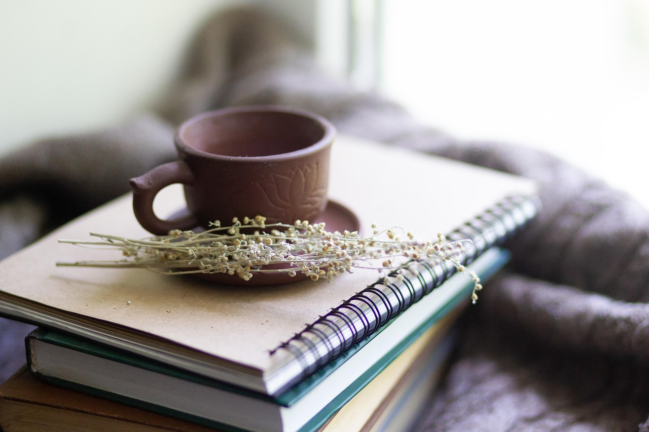 Books, cup, herbs — Simplify Your Health Journey by Purchasing Testosterone Online for Improved Well-Being